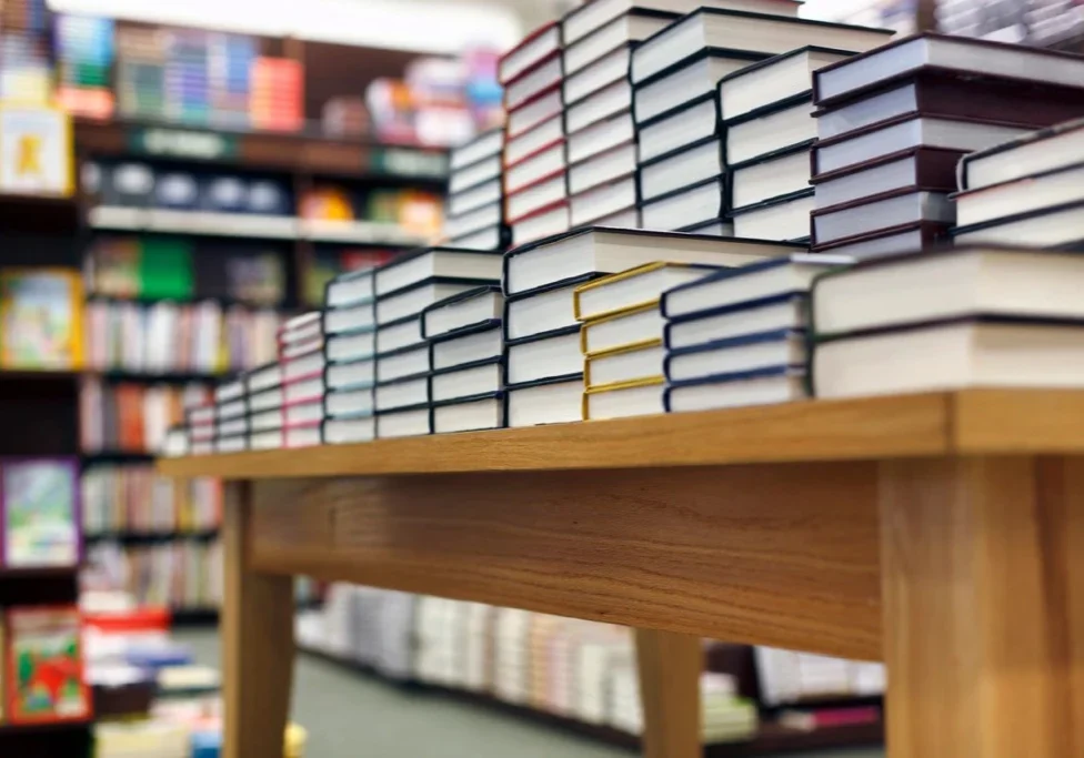 A table with many books on it