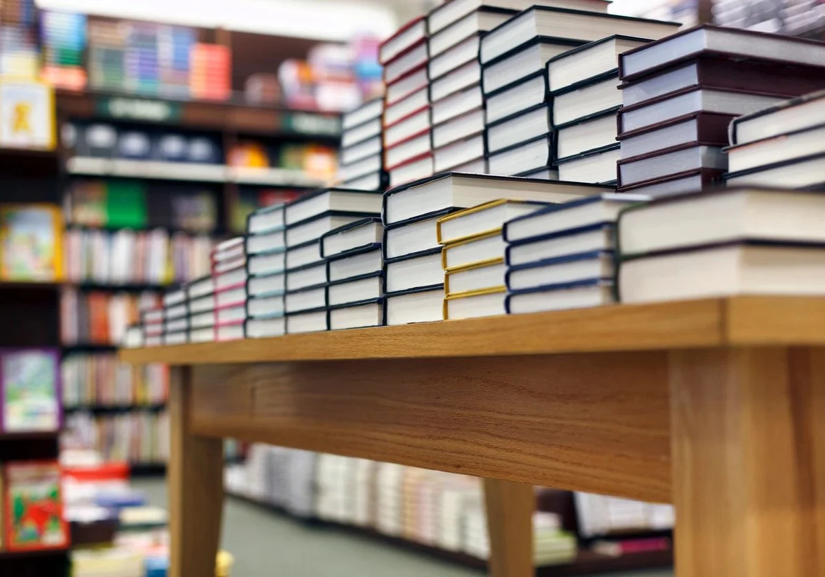 A table with many books on it